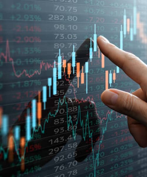 Finger pointing at stock chart